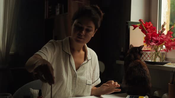 Female Painter Artist Making an Abstract Watercolor Painting alt