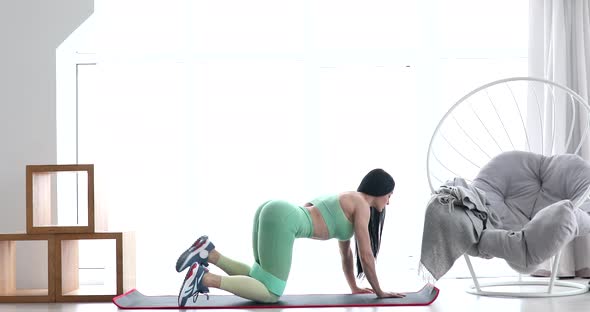 Fitness woman working out for buttocks.