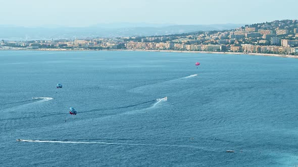 View of the cote d'Azur in Nice, France. Sea distractions, buildings, blue water of the Mediterranea alt