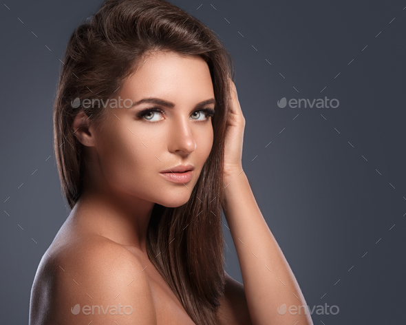 Beautiful and young woman with a artificial eyelashes
