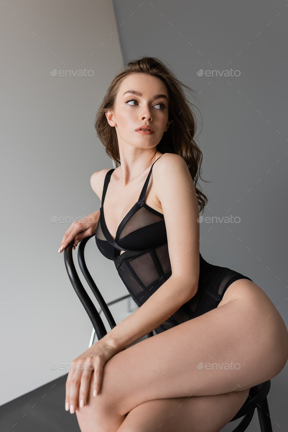 Busty young model posing in stylish lingerie Stock Photo