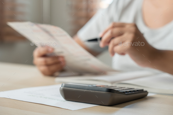 Woman calculate bill budget payment, home accounting concept with calculator