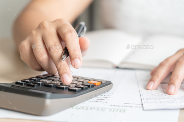 Woman calculate bill budget payment, home accounting concept with calculator