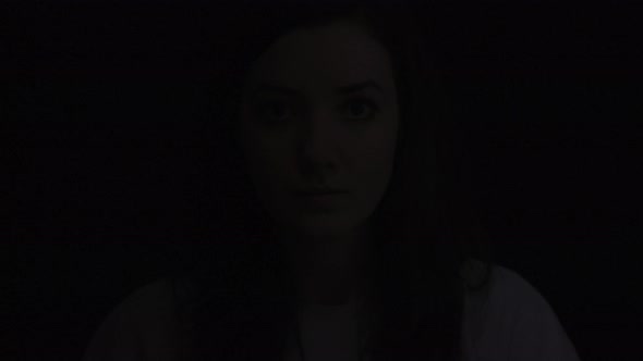 Shadows on a woman's face alt