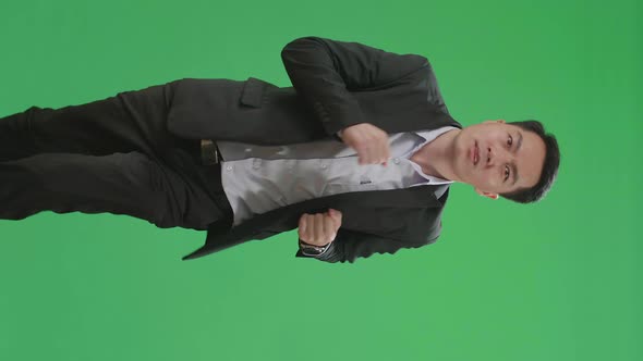 Asian Business Man Running On Green Screen Chroma Key alt