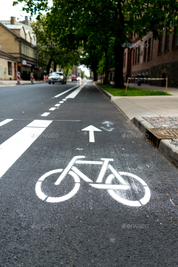 Selective focus of a freshly paint bicycle lane on the side of a