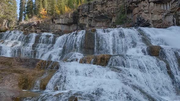 Following waterfall flowing down cascade at Granite Creek alt