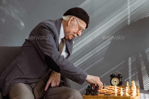 Old Man Playing Chess - Stock Photos