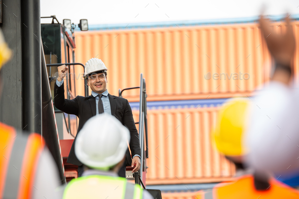 Logistic manager giving public speech and showing support to construction worker