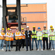 Successful logistic worker team standing at container warehouse - PhotoDune Item for Sale