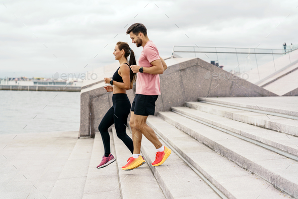 A woman and a man in fitness running clothes. Physical education