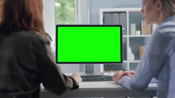 Women Using Green Screen Computer
