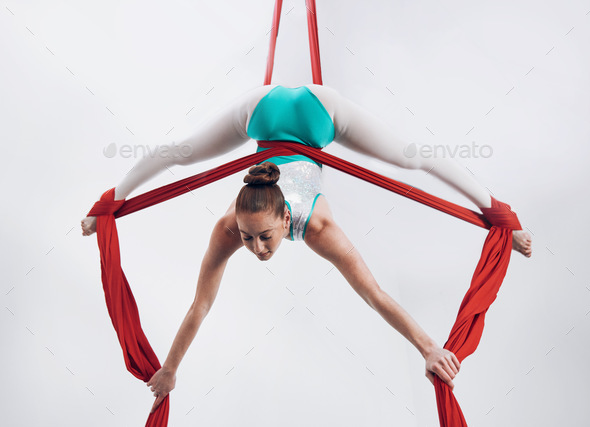 Gymnast, woman acrobat with performance and talent, sports and art with athlete on white background