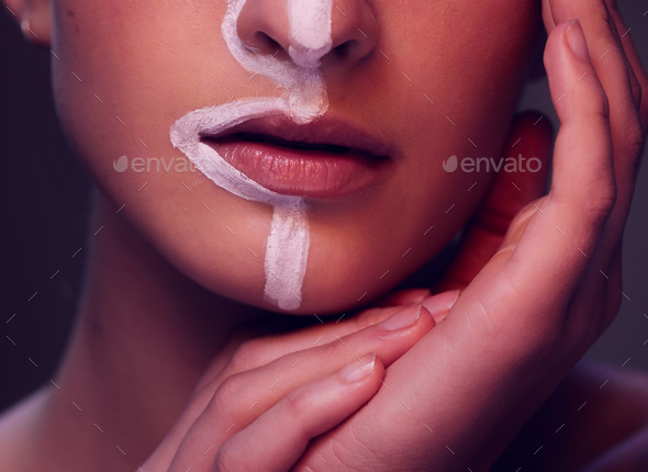 Woman, beauty and paint in studio, lips and closeup for art, wellness and fantasy with cosmetics by