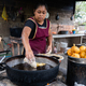 Latin woman preparing food in a rural kitchen - PhotoDune Item for Sale