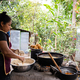 Profile of latin woman preparing food in a rural kitchen - PhotoDune Item for Sale