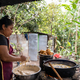 Profile of a woman preparing food in a rural kitchen - PhotoDune Item for Sale