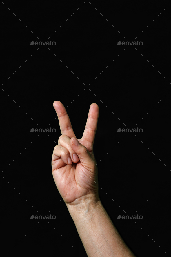 Letter V International sign language dark background International sign