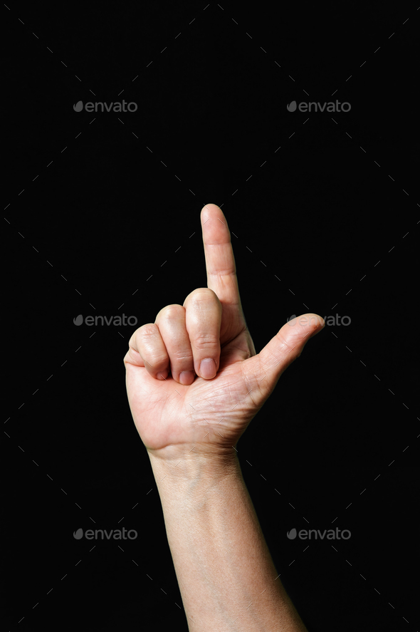 Letter L International sign language dark background Stock Photo by