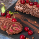 Chocolate roll cake with cream and cherries. - PhotoDune Item for Sale