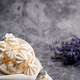 Small white meringues in a white plate on a gray background - PhotoDune Item for Sale