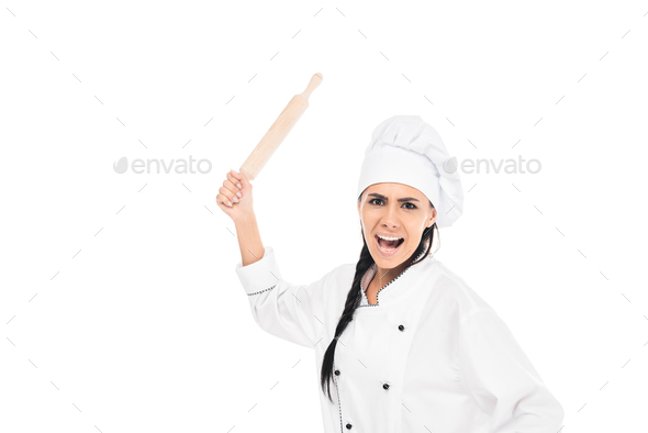 Angry chef in hat holding rolling pin and screaming isolated on white
