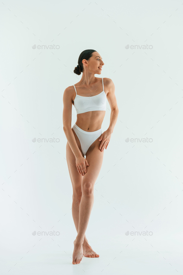 Premium Photo  Particle view woman with sportive slim body type in  underwear that is in the studio