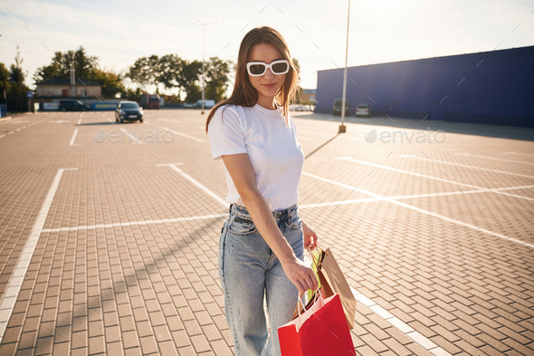 Premium Photo  Trendy woman in fashionable casual clothes with sweatshirt,  bag, shorts and sunglasses outdoors