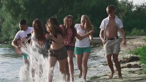 Teenagers Rest on the River Bank alt