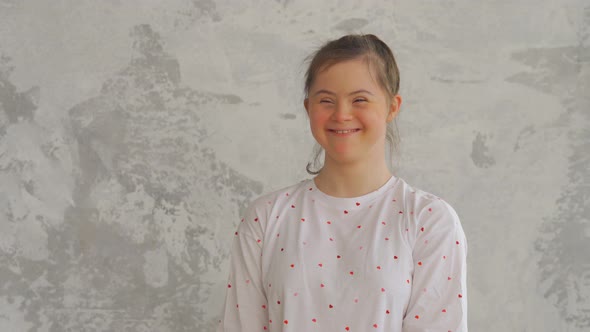 Portrait of Attractive Happy Teenager Girl with Down Syndrome