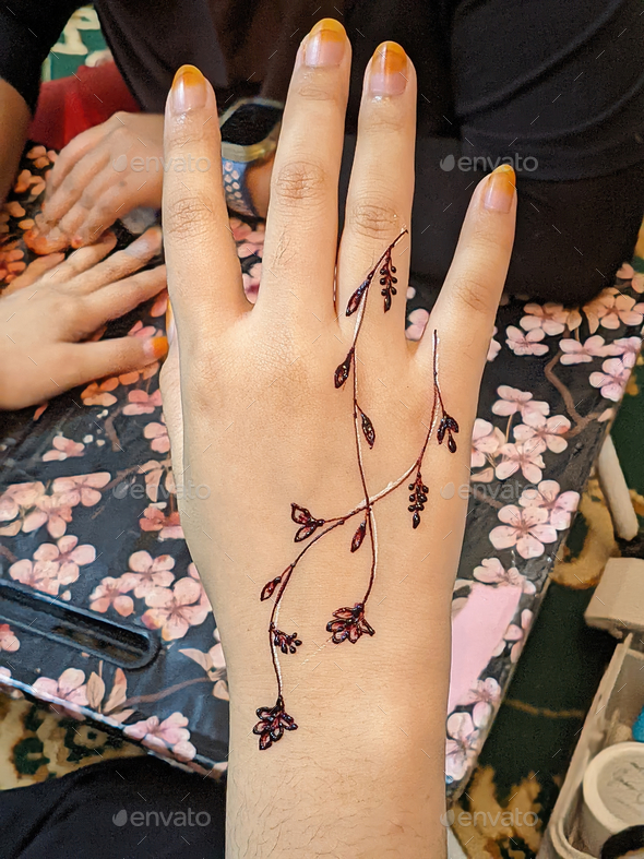 Person's Hand with Brown Henna · Free Stock Photo