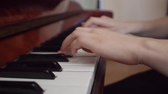 White Woman Playing Piano Hands Close Up alt