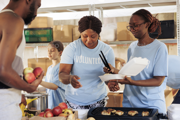 Black women providing free food to needy