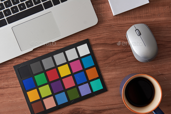 Overhead shot of a working desk with a laptop and a cup of coffee - Stock Photo - Images