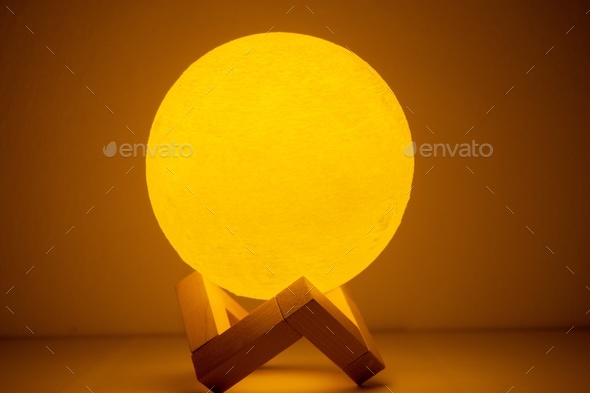 Moon lamp turn on in orange with white background