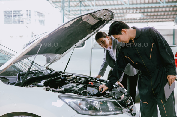 mechanic engineer working checking engine in garage auto shop car insurance claim cost estimate team