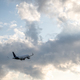 Passenger plane in sky with clouds - PhotoDune Item for Sale