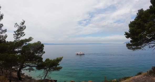 Beautiful Nature Overlooking the Adriatic Sea in Which Sails White Yacht in summer alt