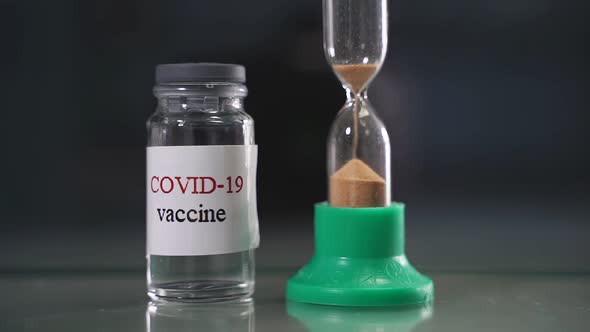 Vaccine Vial and the Concept of an Hourglass It's Time for Vaccination Vaccination Treatment for the
