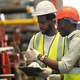 Black worker, Engineer team working helping together in metal factory heavy industry. - PhotoDune Item for Sale