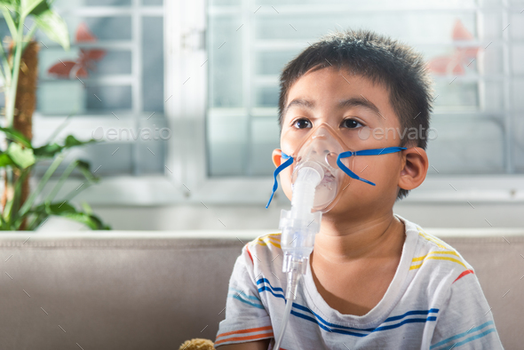 Asian Child Using Nebulizer Mask