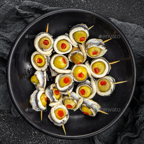olive stuffed anchovy fillet, anchovys roll stuffed olives apetizing  seafood fish marinated Stock Photo by alesaberlezova