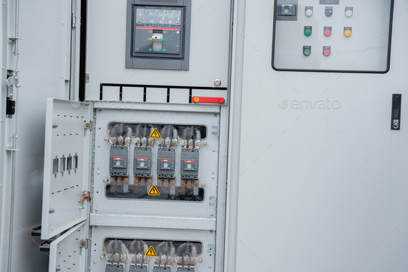 The electrical room of a commercial building contains multiple smart meters,and various meter stacks