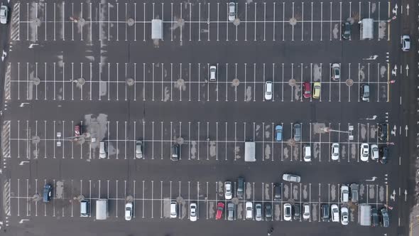 AERIAL: Cars Driving in a Parking Lot During Quarantine 