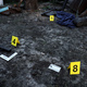 Evidence with yellow CSI marker for evidence numbering on the residental backyard - PhotoDune Item for Sale