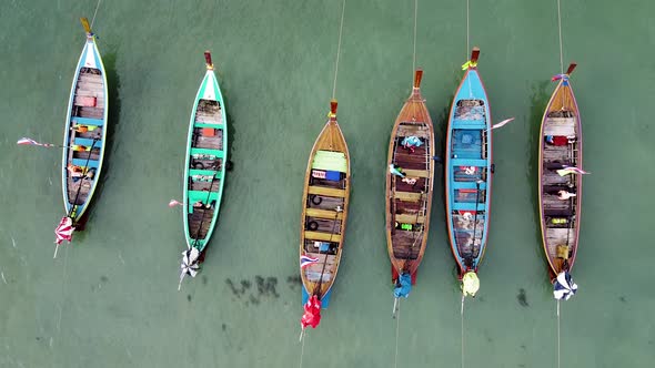 Aerial Downward View of Beautiful Long Tail Boats in Andaman Sea Thailand alt