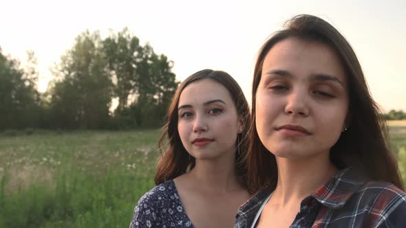 Two Sisters Walk in Nature and Communicate alt