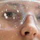 Close up of a woman face wearing protective glasses covered in paint - PhotoDune Item for Sale