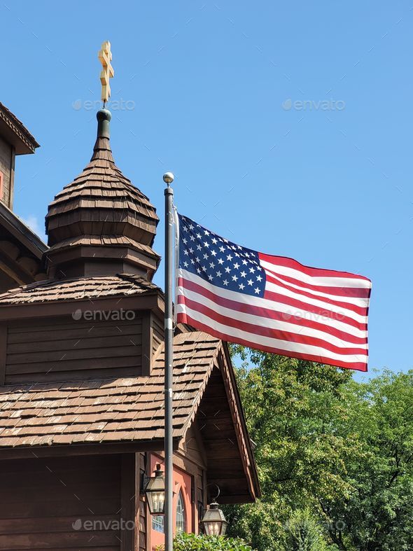 Vertical shot of an American flag waving in the wind