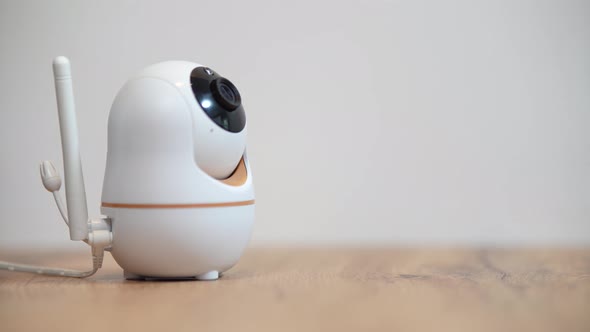 The Baby Monitor Camera with the Rotation Function Monitors the Child in the Room